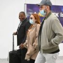 Lindsay Lohan – With husband Bader Shammas catch a flight out of New York