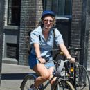 Saoirse Ronan – With Jack Lowden are seen riding bikes in East London - 454 x 502