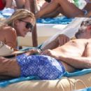 Sylvie Meis – Bikini candids at the beach in Saint Tropez - 454 x 303