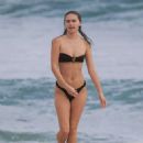 Gabriella Brooks in Black Bikini and Liam Hemsworth on the beach in Byron Bay - 454 x 588