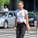 Lila Grace Moss – In crop top, black skirt and Adidas trainers in New York - 454 x 665