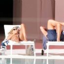 Arabella Chi – Seen by the pool with a mystery male friend in Ibiza - 454 x 322
