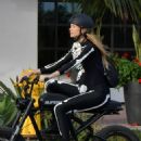 Behati Prinsloo – In a skeleton costume riding her electric bike in Montecito