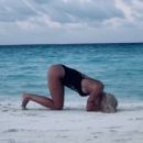 Ilary Blasi in Swimsuit – Doing yoga at the Maldives - 454 x 410