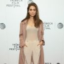 Caitlin Stasey attends the 