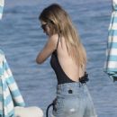 Chloe Lloyd in Black Swimsuit on the beach in Mykonos - 454 x 681