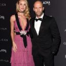 Truly, madly, deeply! Rosie Huntington-Whiteley flashes cleavage in plunging pink gown at LACMA gala with Jason Statham