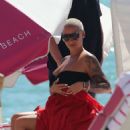 Amber Rose in Black Bikini on the beach in Miami