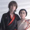 John Lennon and Yoko Ono during the filming of a promotional video for their album Double Fantasy in SoHo on November 26, 1980 - 454 x 632