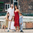 Gina Coladangelo and Oliver James Mark Tress celibrating his 50th and her 40th birthdays with their three children outside their £4.5million London home