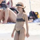 Aurora Ramazzotti – In a black bikini on holiday on the beach in Formentera - 454 x 681