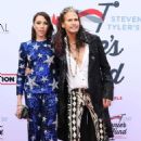 Steven Tyler and Aimee Preston at the 2022 Grammys Awards on April 3, 2022 - 454 x 681