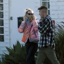 Behati Prinsloo – Steps out with her daughter in Los Angeles