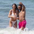 Alice Goodwin in White Bikini on the beach in Marbella