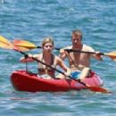 Jennette McCurdy wearing a pretty bikini and board shorts was spotted kayaking with a male friend in Maui