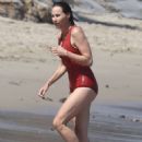 Minnie Driver – Wears a red swimsuit in Malibu