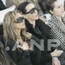 Victoria Beckham and L'Wren Scott attend the Chanel fashion show during Paris Fashion Week (Haute Couture) Spring/Summer 2006 on January 24, 2006 in Paris, France - 333 x 500