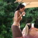 Arianna Ajtar – In a gold bikini with a brown sarong in Bridgetown - 454 x 506