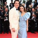 Miles Teller and Keleigh Sperry wear Celine - 2022 Cannes Film Festival on May 19, 2022