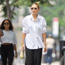Gigi Hadid – Wearing white shirt as she takes a stroll on the streets of New York
