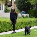 Troian Bellisario – Out for a walk with her dog in Los Angeles - 454 x 474