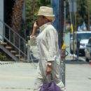 Regina King – Carrying a purple leather Gucci purse in West Hollywood