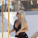 Bianca Gascoigne – Seen in a black swimsuit at Ibiza’s Cala de Bou beach - 454 x 573