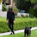 Troian Bellisario – Out for a walk with her dog in Los Angeles - 454 x 489