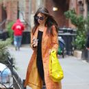 Emily Ratajkowski – Looks chic in an orange trench coat in New York