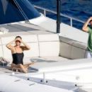 Selena Gomez – In black swimsuit on a boat in Positano