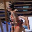Malu Trevejo – In an orange bikini in Miami Beach - 454 x 303