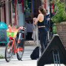 Mel C &#8211; Checks out a lime bike in central London