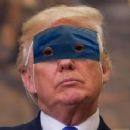 President Trump puts on his mask