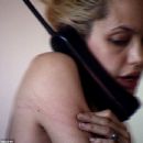 Bloodshot hollow eyes, emaciated arms and rambling on the phone: Haunting video of Angelina Jolie the heroin addict