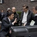 Co-Director/Co-Writer RICKY GERVAIS (left center), Co-Director/Co-Writer MATTHEW ROBINSON (right center) and Script Supervisor SCOTT PETERSON (right) on the set of Warner Bros. Pictures', Radar Pictures' and Media Rights Capital's romantic com