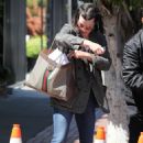 Milla Jovovich – Shopping candids on Melrose Place in West Hollywood - 454 x 681