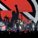Tom Morello of Prophets of Rage performs onstage during KROQ Almost Acoustic Christmas 2017 at The Forum on December 9, 2017 in Inglewood, California - 454 x 302