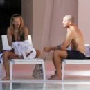 Arabella Chi – Seen by the pool with a mystery male friend in Ibiza - 454 x 335