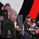 Tom Morello of Prophets of Rage performs onstage during KROQ Almost Acoustic Christmas 2017 at The Forum on December 9, 2017 in Inglewood, California - 454 x 300