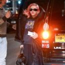 Madonna, 64, Covers Up Her Pink Hair In Oversized Graphic Jacket at JFK Airport in New York