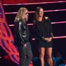 Vince Neil and Sara Evans present an award onstage at the 2014 CMT Music Awards at Bridgestone Arena on June 4, 2014 in Nashville, Tennessee - 418 x 594