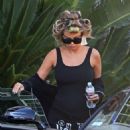 Carmen Electra in  a casual ensemble of a black tank top with sweats and a hoodie out and about in LA
