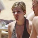 Jennette McCurdy wearing a pretty bikini and board shorts was spotted kayaking with a male friend in Maui