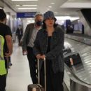 Jennifer Tilly – Waiting for her luggage after her flight into Los Angeles at LAX - 454 x 681