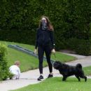 Troian Bellisario – Out for a walk with her dog in Los Angeles - 454 x 382