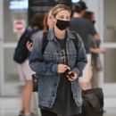 Lili Reinhart – Touch down at JFK Airport in New York