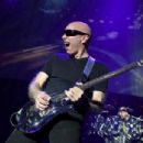 Joe Satriani performs as part of the G3 concert tour at Brooklyn Bowl Las Vegas at The Linq Promenade on January 17, 2018 in Las Vegas, Nevada - 454 x 304