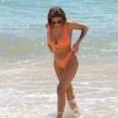 Kayleigh Morris – In orange bikini on the beach in Cyprus - 454 x 535