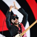 Tom Morello of Prophets of Rage performs onstage during KROQ Almost Acoustic Christmas 2017 at The Forum on December 9, 2017 in Inglewood, California - 412 x 600