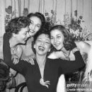 Dominican actress Maria Montez (C) poses with actress Claire Duhamel (L) and sisters Teresita and Adita, on January 24, 1951 at the Edouard VII Theater in Paris after the performance of the play "L'île heureuse", written by her husband French actor Jean-P
